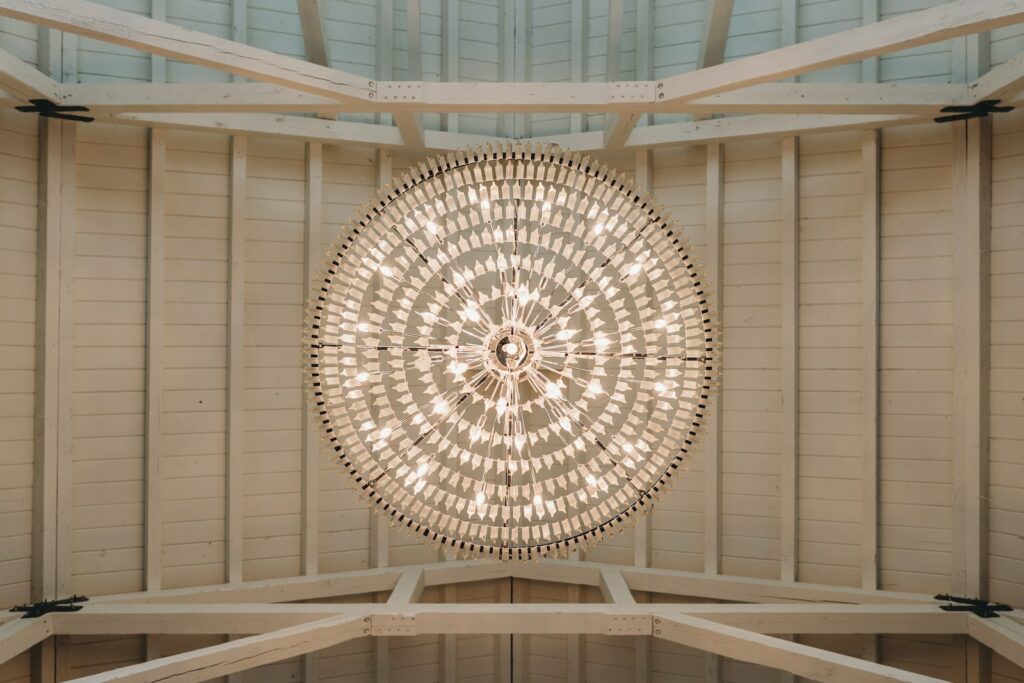 a circular light hanging from the ceiling of a building